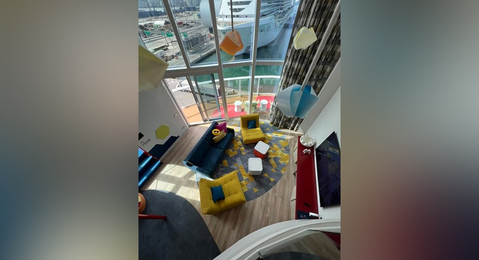 A seating area in the Ultimate Family Townhouse on the Icon of the Seas