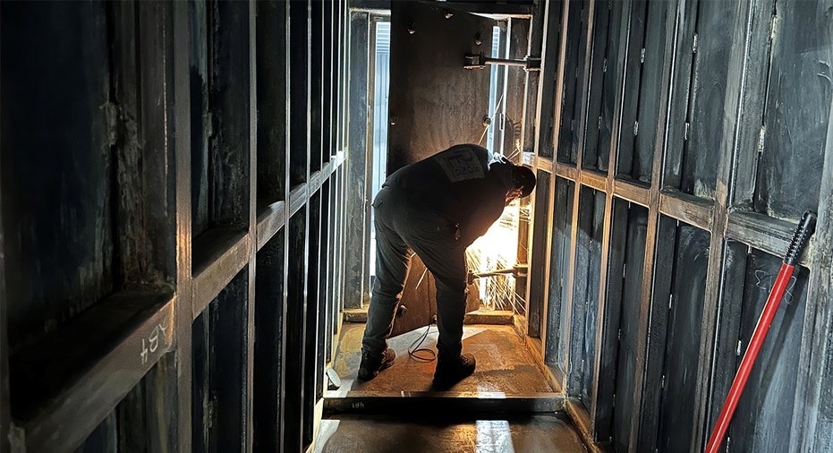 Worker performs welding work on bunker