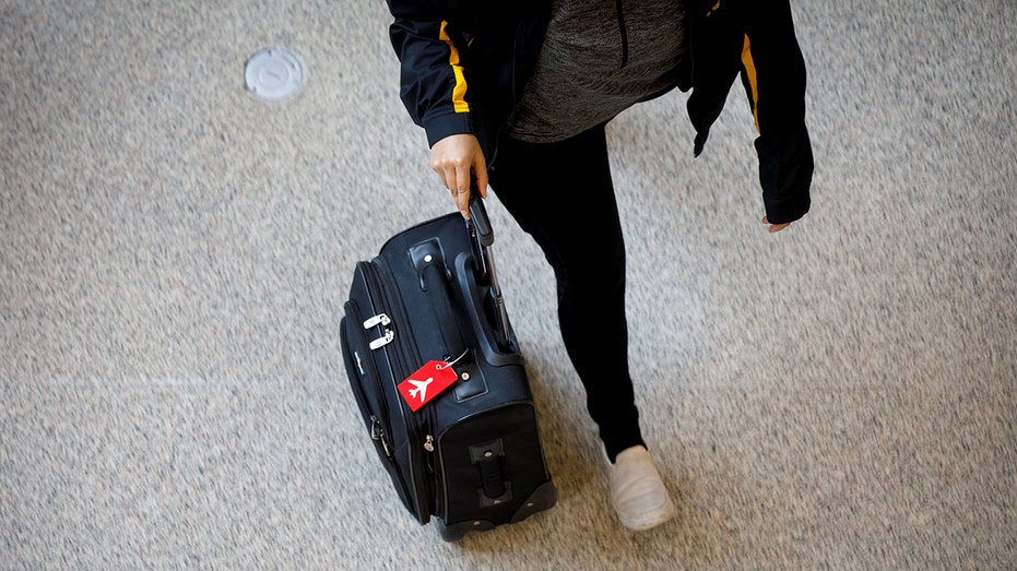 Man commutes through airport