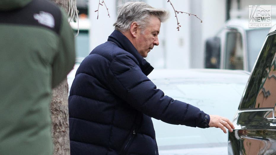 Alec Baldwin indicted walks to his car