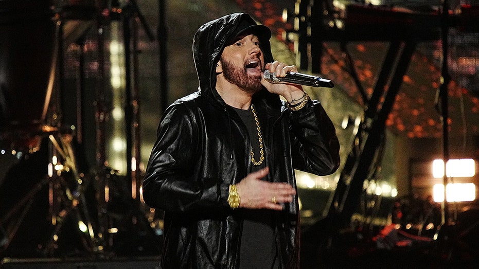 Eminem performing with microphone