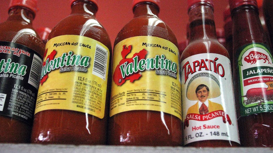 Mexican hot sauce bottles on shelf