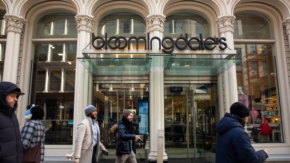 Pedestrians walk by a Bloomingdale's in New York