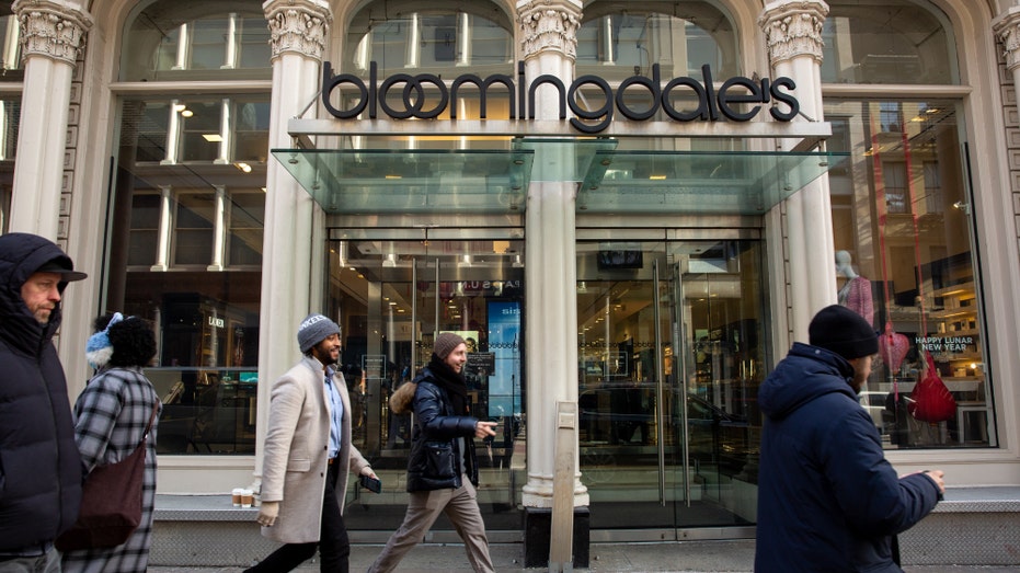 Pedestrians walk by a Bloomingdale's in New York