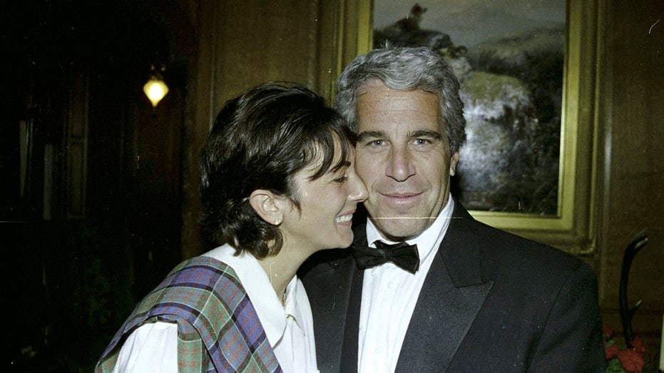 Ghislaine Maxwell and Jeffrey Epstein smile for a photo