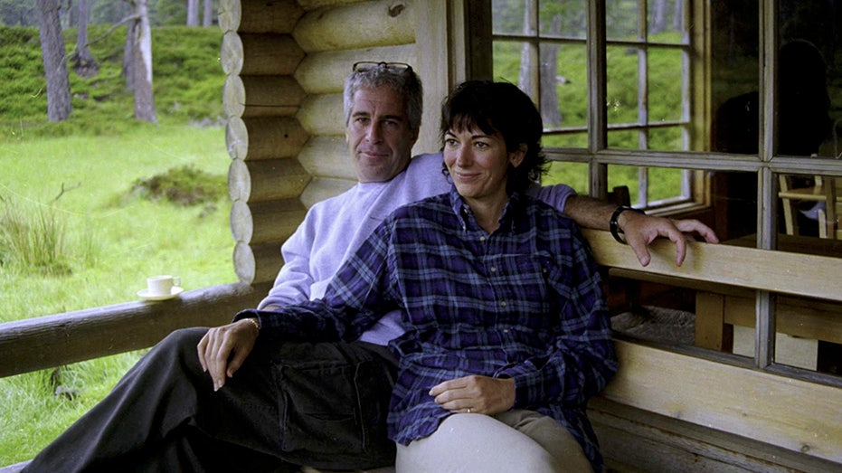 Ghislaine Maxwell and Jeffrey Epstein smile for a photo.
