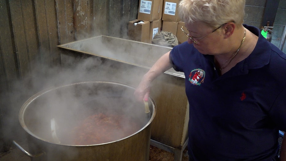 A woman is boiling frozen crawfish