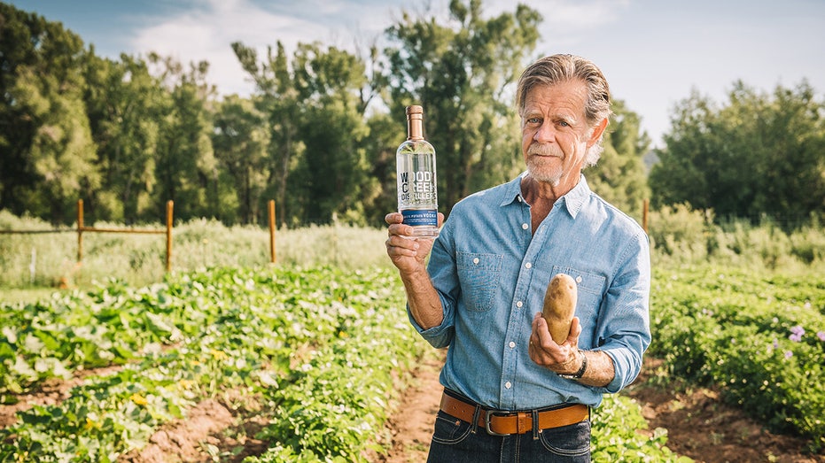 William H. Macy holding a potato and a bottle of liquor