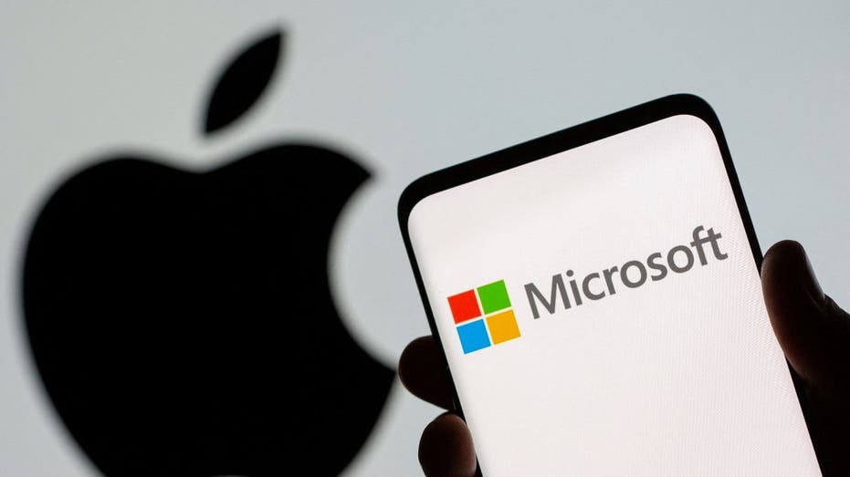 Microsoft logo over Apple logo