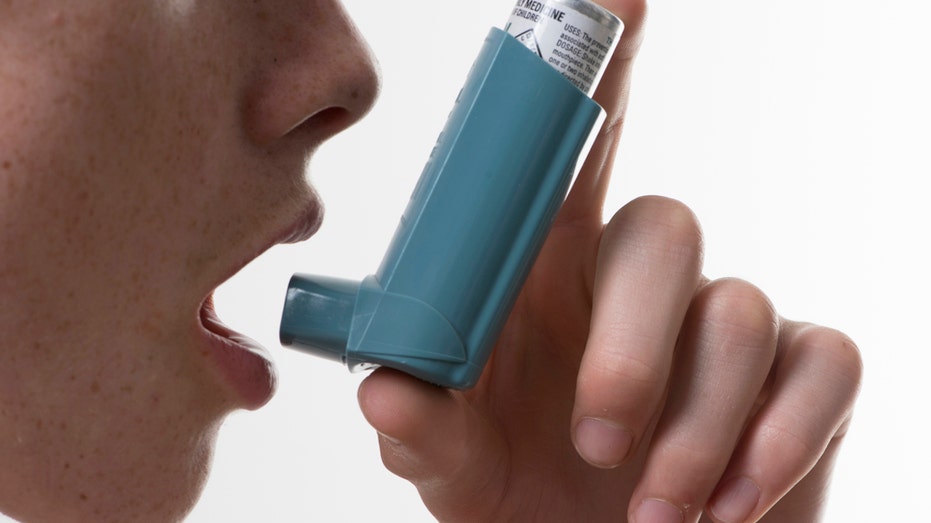 Person using inhaler