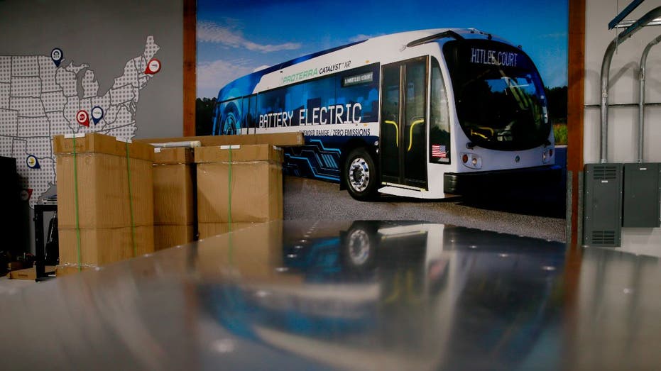 Proterra electric bus parked outside garage