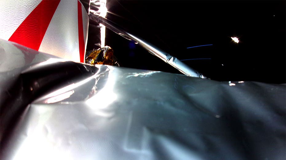 Multi-Layer Insulation is seen in the foreground of this shot taken in space by the Peregrine lunar lander
