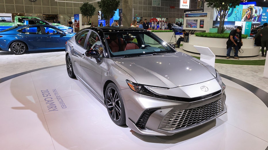 A Toyota Camry on display at an auto show