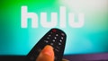 BRAZIL - 2022/05/10: In this photo illustration, a hand holding a TV remote control in front of the Hulu logo on a TV screen. (Photo Illustration by Rafael Henrique/SOPA Images/LightRocket via Getty Images)
