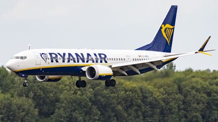 Ryanair Boeing 737 MAX aircraft flying on final approach. On Friday, the budget carrier said it would allow parents to sit with their children for free. - Fox Business News