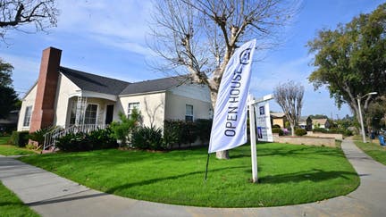 An "Open House" flag is seen in front of a home for sale in Alhambra, California on January 18, 2024. Mortgage rates this week have dropped to its lowest level in eight months for potential US homebuyers but affordability remains a challenge.