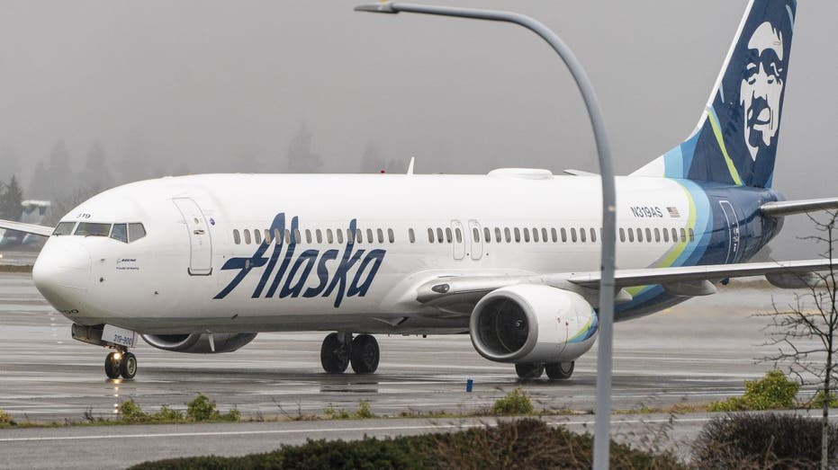An Alaska Airlines Boeing 737-900ER aircraft on the tarmac