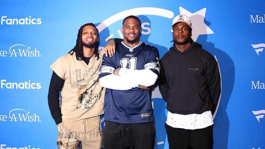 Damar Hamlin, Micah Parsons and Davante Adams pose