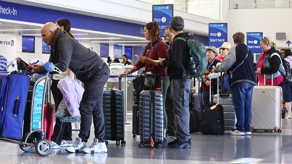 Travelers wait at LAX airport