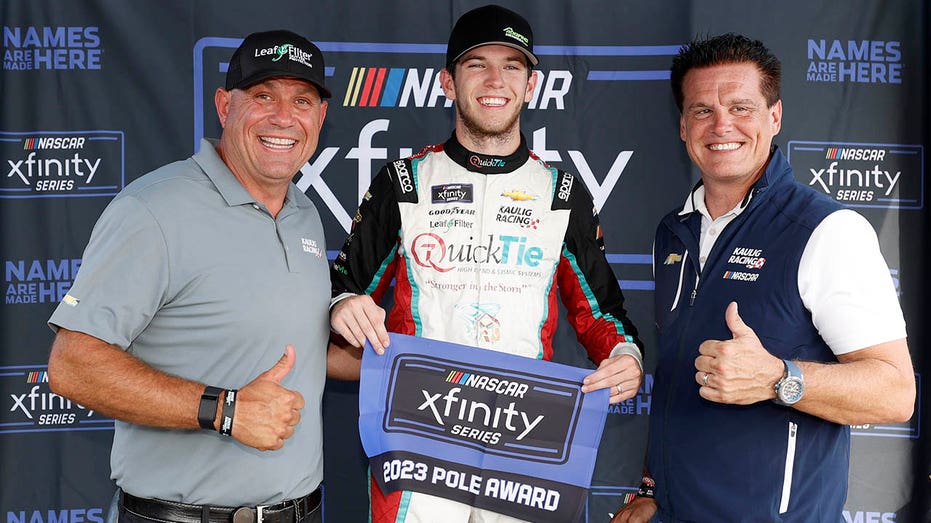 Kaulig Racing president Chris Rice, driver Chandler Smith and Matt Kaulig pose