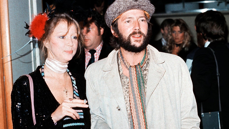 Pattie Boyd walks with Eric Clapton