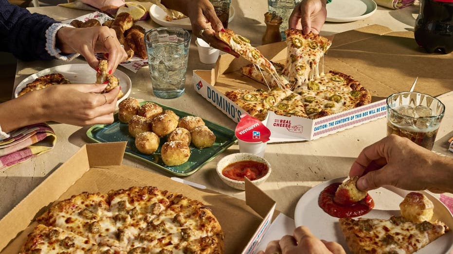 Two Domino's pizza with soda, garlic bites and cinnamon twists