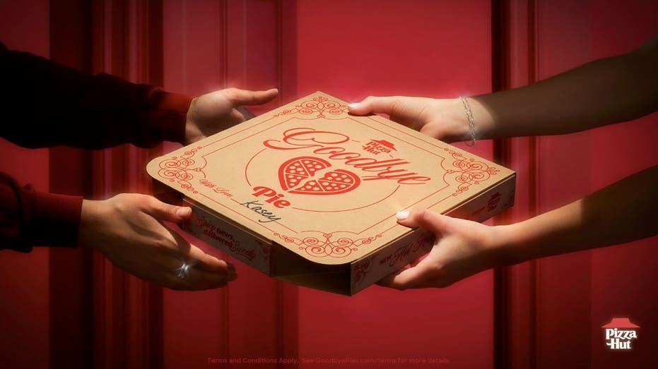 Hands holding "Goodbye Pie" box