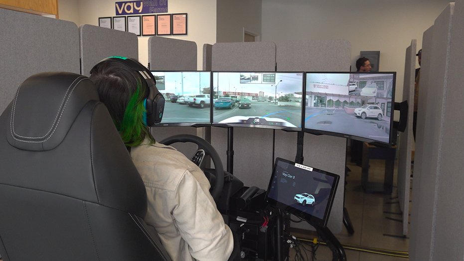 A Vay teledriver sits behind the wheel remotely