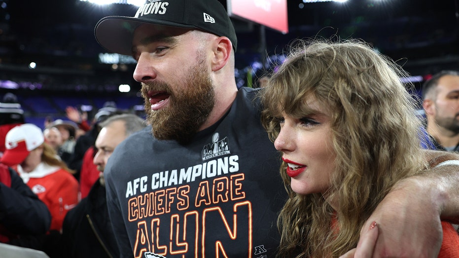 Taylor Swift and Travis Kelce celebrate on the field after AFC championship