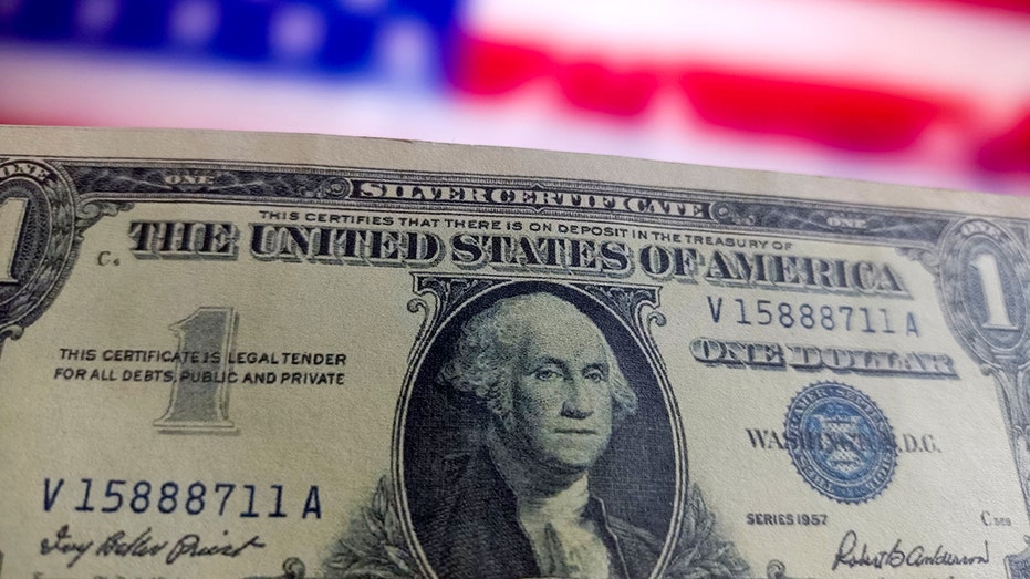 US dollar in front of flag background