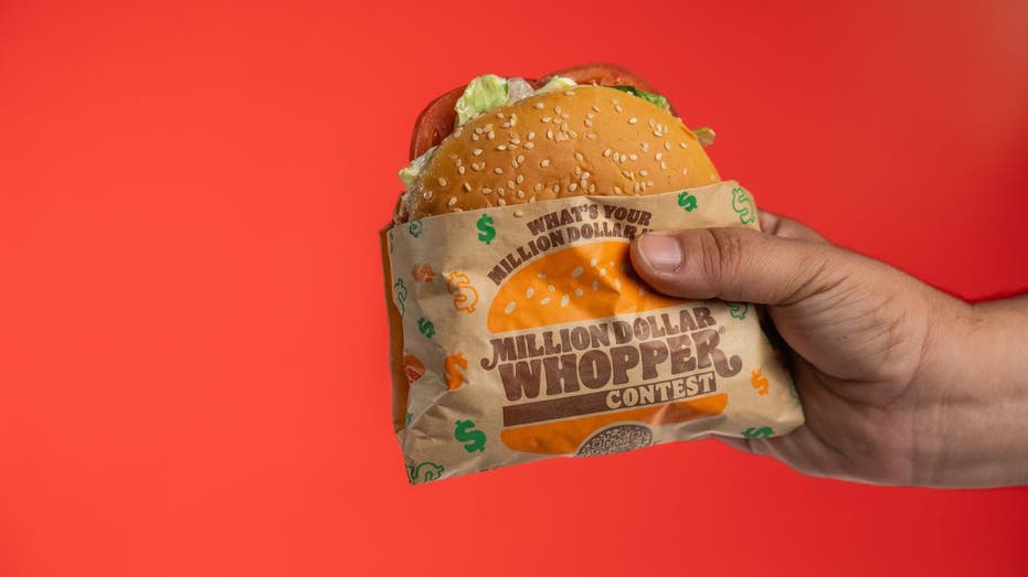 Hand holding Whopper Sandwich