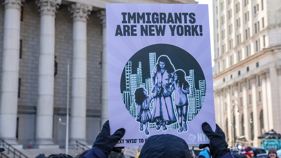 Protest sign reads, "Immigrants are New York!"