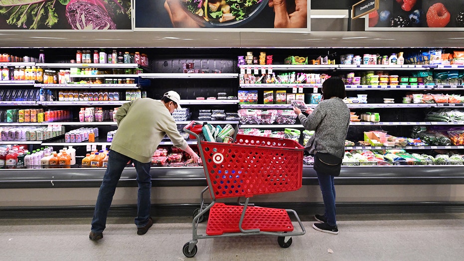 People shop in the food section at Target
