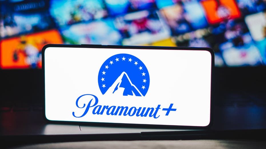 The Paramount Plus logo is displayed on a smartphone screen.