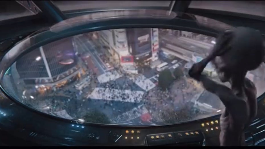 Part of the UFO Super Bowl Commercial shows an alien watching humans on Earth.