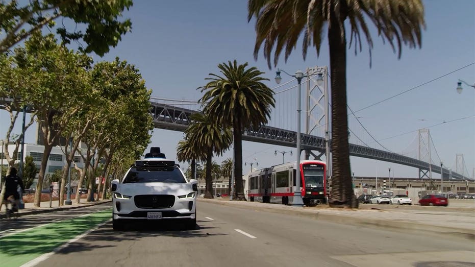 Waymo with San Fran bridge