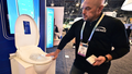 A man demonstrates the features of a bidet toilet seat at the 2024 Consumer Electronics Show.
