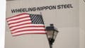 A US flag flies from a light post in front of a Wheeling-Nippon Steel facility in in Follansbee, West Virginia, US, on Friday, March 15, 2024. Nippon Steel Corp. said its determined to complete its $14.1 billion acquisition of United States Steel Corp., even after President Joe Biden stated the company should stay in US hands. 
