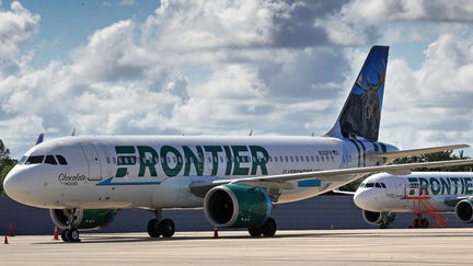 Frontier Airlines planes are seen parked at Orlando International Airport in April 2020. A Frontier flight from Charlotte to Orlando was canceled after a "strong odor" was reported in the cabin, the airline says.