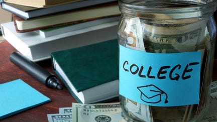 Jar with label and money on the table. Saving money concept.