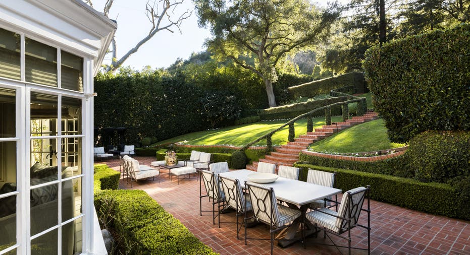 Patio of Judy Garland's home with shrubbery all around