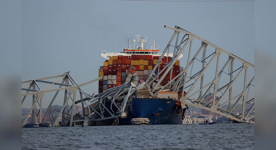 parts of Maryland's Francis Scott Key Bridge lies on cargo ship