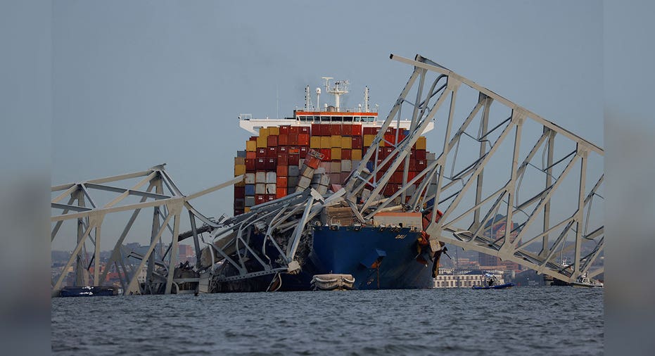 parts of Maryland's Francis Scott Key Bridge lies on cargo ship