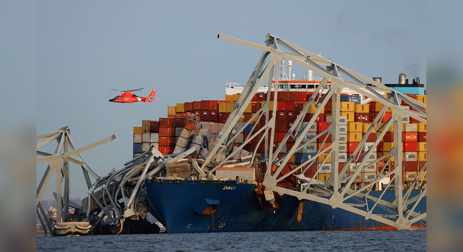 coast guard helicopter flies over Baltimore Harbor