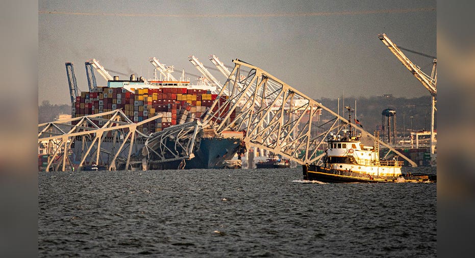 cargo ship lies beneath broken MD bridge