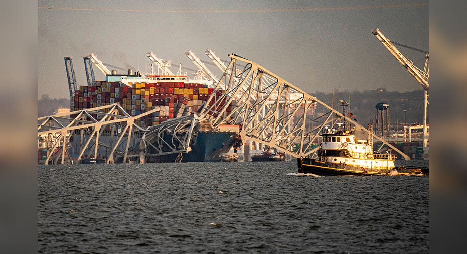 cargo ship lies beneath broken MD bridge