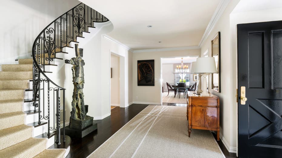 Foyer entrace with spiral staircase in Judy Garland's home