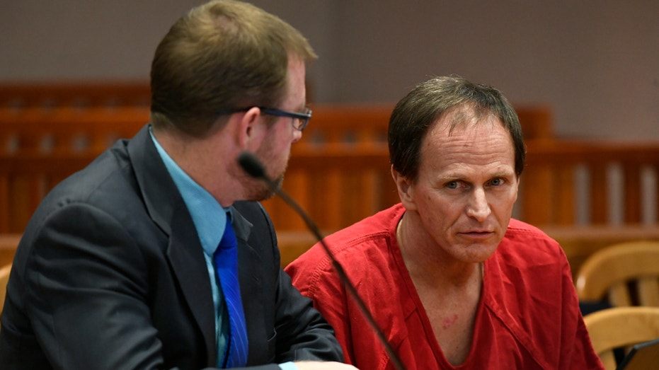 Alex Christopher Ewing, the alleged Hammer Killer, listens in court with his public defender during his appearance before Jefferson County District Court Judge Tamara Russell for an advisement on March 10, 2020 in Golden, Colorado. Ewing has been extradited and returned to Colorado to face charges for the 1984 murder of 50-year-old Patricia Smith in Jefferson County. He has been charged with four counts of first degree murder under different theories: One count of first degree murder-after deliberation and three counts of first degree murder-felony murder and two sentence enhancements. Ewing also faces charges in Arapahoe County for the murders of Bruce and Debra Bennett, their seven-year-old daughter and the sexual assault of their three-year-old daughter. On Marcy 2, 2020, Ewing made his first appearance in the Arapahoe County District Court. According to the arrest affidavit, Ms. Smith was killed at her home in Lakewood on January 10, 1984 and the Bennet family was killed in their home in Aurora six days later.