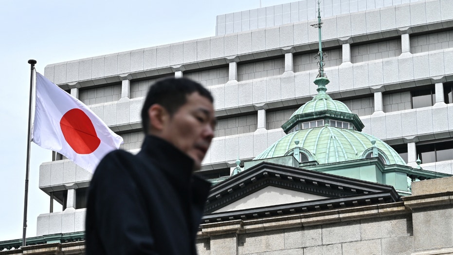 A man walks past the Bank of Japan headquarters complex in central Tokyo on March 19, 2024.