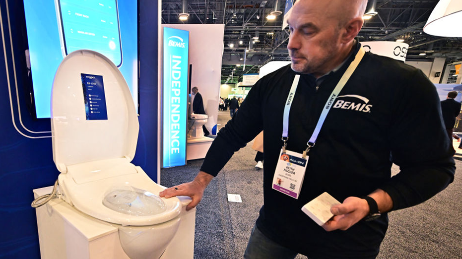 Man demonstrates bidet seat